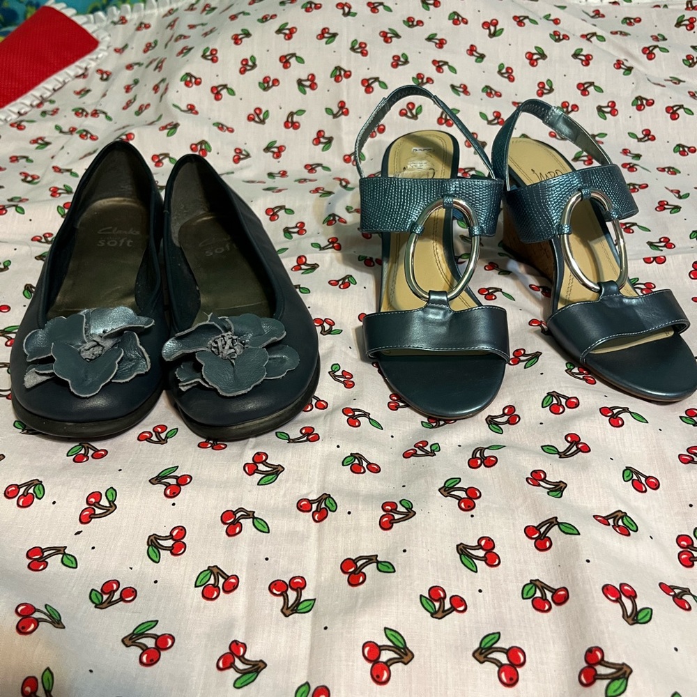 Two pair of blue dress shoes, one casual and one dressy.  Clarks brand and Impo.
